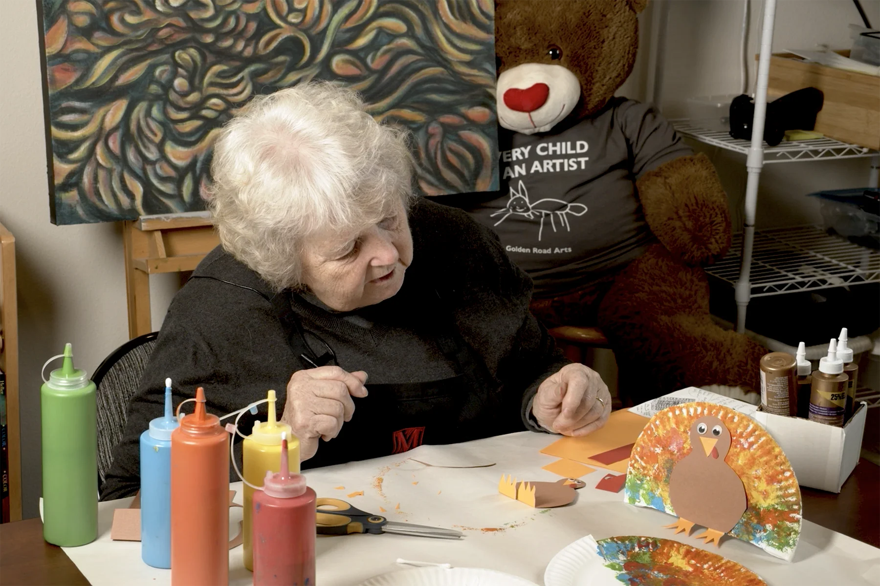 Barbara Mason examines the Thanksgiving turkey artwork