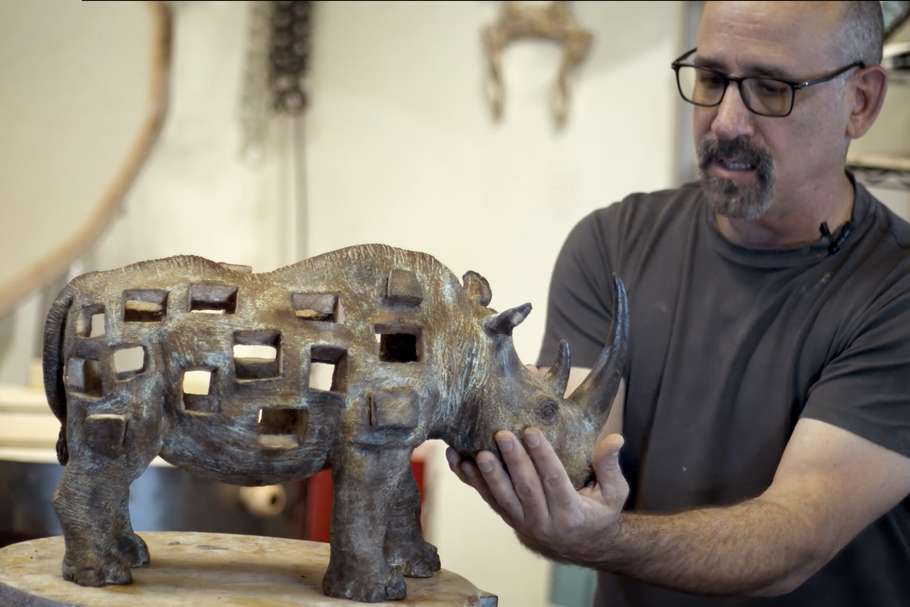 Disappearing rhinoceros sculpture by Tony Furtado.