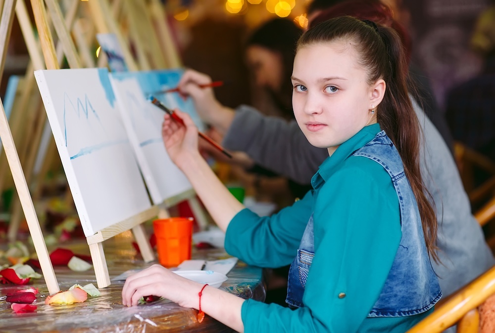Children exploring their creativity through art.