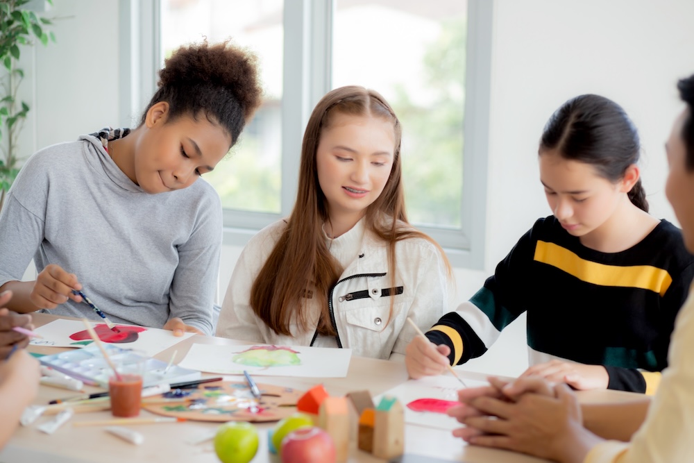 Children developing creative thinking skills through art.