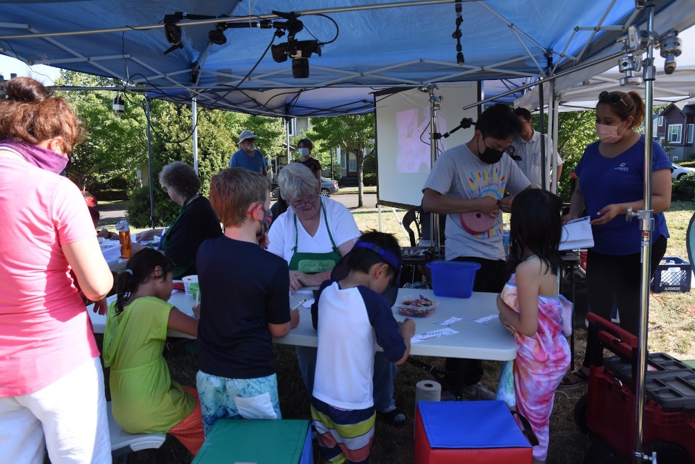 Kids enjoying free summer art activities.